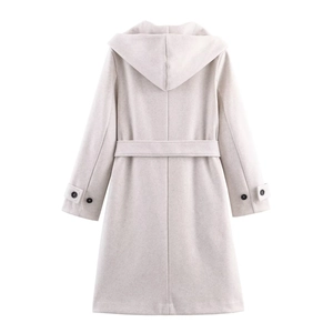 Detail view of long hooded coat in beige with adjustable waist belt and cuff straps