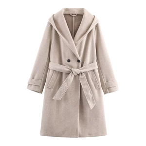 Detail of oatmeal hooded coat showing waist belt buttons and decorative cuff straps