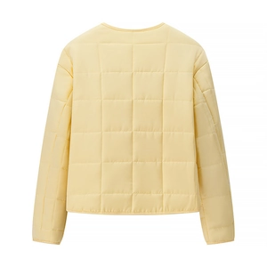 Back view of light yellow quilted cotton jacket featuring minimalist square stitching detail