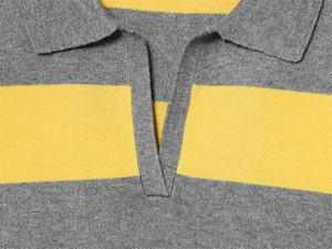 Detailed close-up of grey and yellow striped knit polo collar with fine stitching