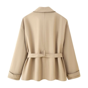 Back view of khaki cropped trench coat with waist belt and decorative sleeve straps