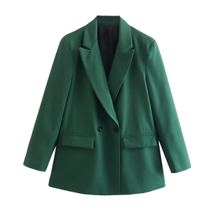Detail of dark green double-breasted blazer with classic notch lapel and flap pockets