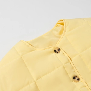 Women's light yellow quilted jacket with crew neck and stylish checkered pattern stitching