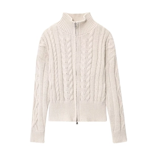 Close-up of beige cable knit sweater featuring a high-neck collar and silver metal zipper
