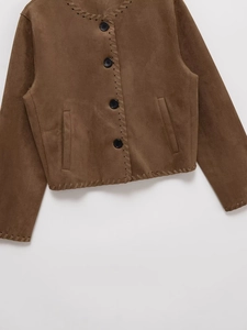Close-up of hand-stitched edging on a brown suede texture round neck jacket with buttons