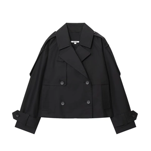Detail view of water-resistant black short trench coat with buttons and neck labels