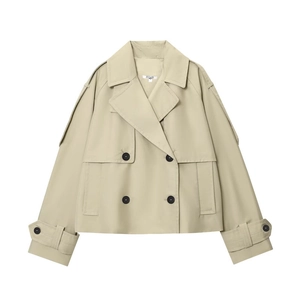 Detailed view of khaki short trench jacket with double-breasted buttons and epaulettes