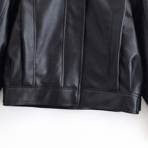 Women's street fashion textured PU leather jacket with drop shoulders and sleek black finish