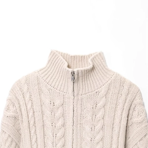 Women's cream oversized cable knit sweater with stand collar and metal zipper detail