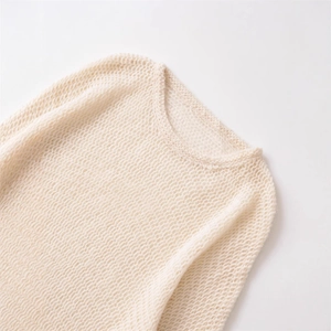 Chic cream hollow-out knit sweater featuring a crew neck and loose mohair texture