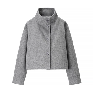 Detail of grey wool jacket featuring high stand collar and single-breasted button closure