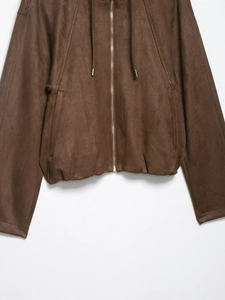Detail of dark brown suede hooded jacket with gold metal zipper and drawstring