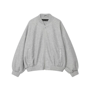 Detailed close-up of the gray wool bomber jacket collar and embroidered brand neck label