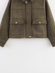Detailed view of olive green faux suede jacket featuring silver snap buttons and front pockets