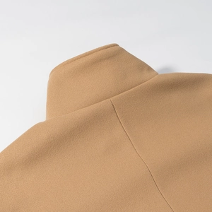 Detail of camel wool coat collar and back seam stitching with premium fabric texture