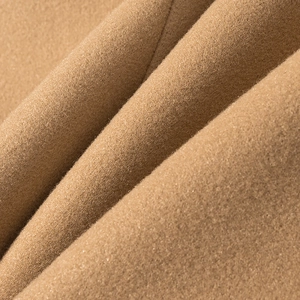 Close-up of premium camel wool coat fabric showing soft texture and fine fiber details