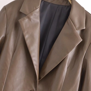 Chic dark brown faux leather blazer with lapel collar and relaxed vintage silhouette