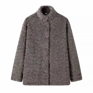 Detailed macro shot of dark grey boucle fleece texture on this standing collar coat