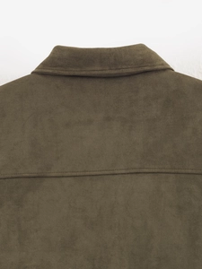 Macro shot of dark green faux suede jacket showing detailed collar and double-stitched yoke