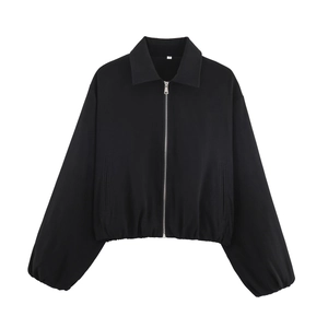 Close-up of black zip-up jacket featuring a classic collar and silver metallic zipper detail