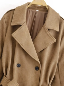 Close-up of double-breasted camel suede trench coat with black buttons and notched lapels