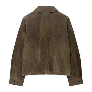 Detail of the back stitching and soft suede texture on a dark brown lapel jacket