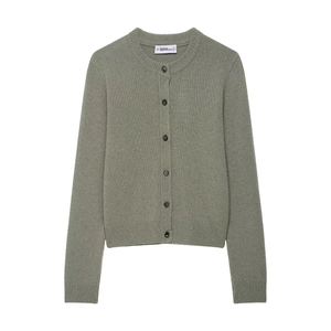 Close-up of sage green knit cardigan with black buttons and ribbed hem details