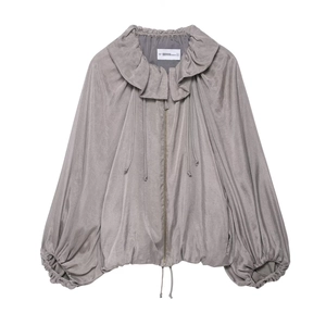 Detail of grey bomber jacket with oversized ruffled collar and puffed lantern sleeves