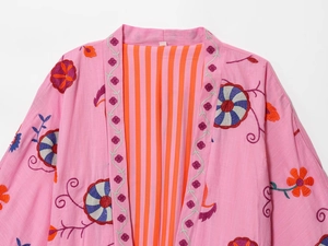 Detailed view of floral embroidery on pink cotton linen kimono cardigan jacket for women