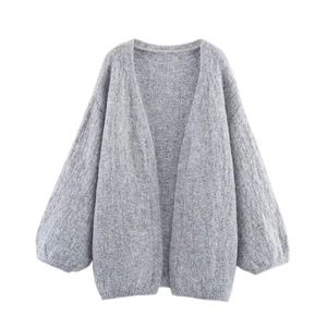 Detail of grey fuzzy knit cardigan featuring dropped shoulders and lantern sleeves