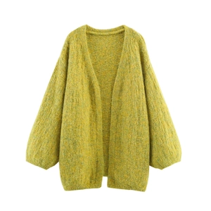Close-up of loose knit cardigan texture in mustard yellow mohair wool blend