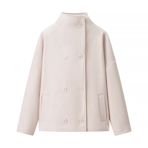 Detail view of pink short wool coat with stand collar and double-breasted buttons