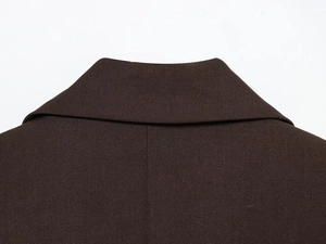 Detailed close-up of dark brown blazer collar with high-density twill fabric texture