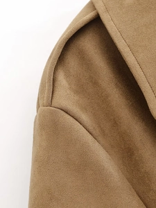 Detailed macro view of the premium suede fabric texture and reinforced shoulder seams