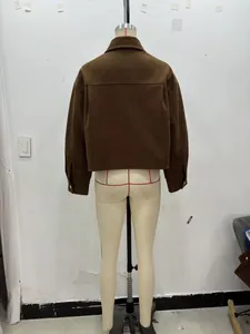 Rear view of brown corduroy jacket showing drop shoulder design and textured fabric