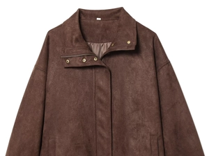 Detail of brown suede jacket showing zipper and golden metal snap fasteners