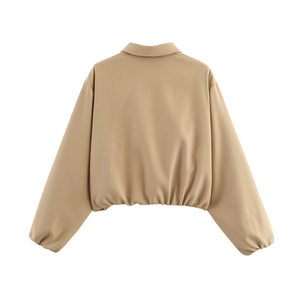Rear view of khaki short puffer jacket featuring elastic waist hem and drop shoulders
