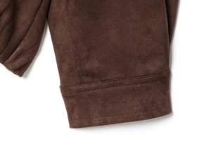 Detail of dark brown faux suede jacket sleeve showing high-quality double-stitch sewing