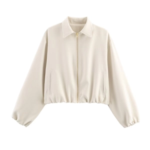 Close-up detail of cream white PU leather jacket showing zipper and collar texture