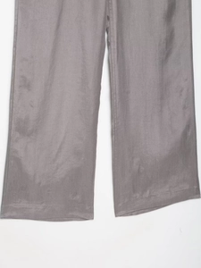 Close-up of wide-leg gray trousers hem featuring professional twill fabric texture