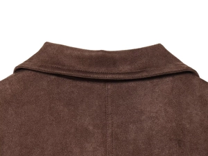 Detailed view of dark brown suede jacket collar with reinforced stitching and soft texture