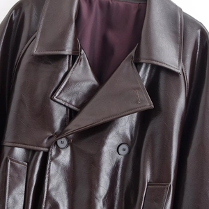 Deep brown PU leather double-breasted trench coat with wide lapels and purple satin lining