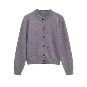 Detailed view of grey knitted cardigan with round neck and black buttons on white background