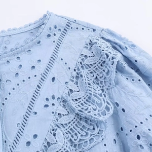 Women's light blue shirt with hollow embroidery and vintage lace details on shoulder