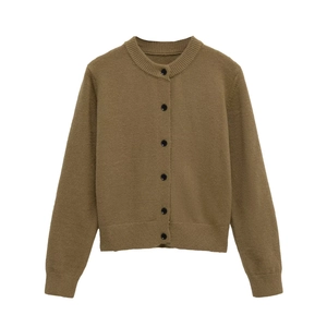 Detail view of khaki knit cardigan featuring six black buttons and ribbed texture cuffs