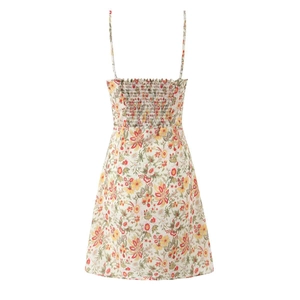 Detail view of smocked elastic back and adjustable straps on summer floral mini dress