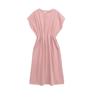Detail of summer dress featuring waist pleats and side pockets in dusty rose color