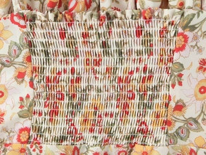 Macro detail of elastic smocking texture and colorful floral pattern on summer dress