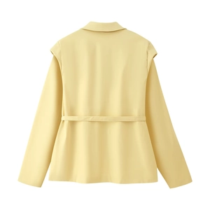Detail of light yellow long-sleeve blazer showing back collar and waist belt tie