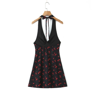Detail of halter neck tie and ruched bust on black cherry print mini dress